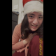 For her 100th video, Emi wears a Santa hat and sweater, bends over and pushes out a naughty present, shows it off with a smile, then reveals the pile on the floor. Vertical format video. 108 MB, MP4 file. Over 19 minutes.